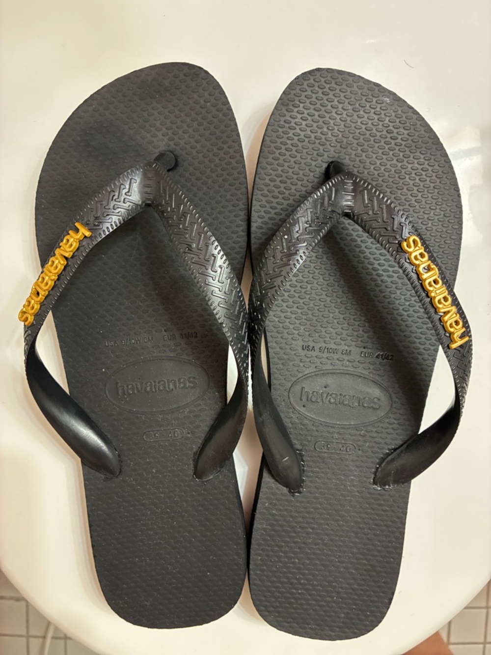 Havaianas Black Flip Flops with Yellow Logo Accents